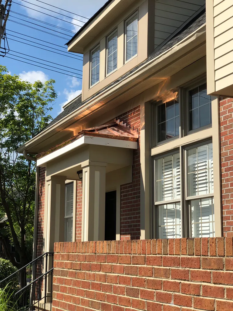 Metal roof cost and installation detail on a Cleveland Heights, OH home by Uston Roof and Masonry